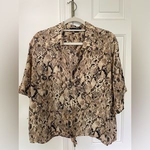 Only worn a couple of times. Snake pattern tie bottom short sleeve blouse